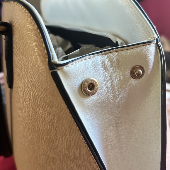 Tote style purse never used. Purse still has its original shape. - Picture 5 of 6